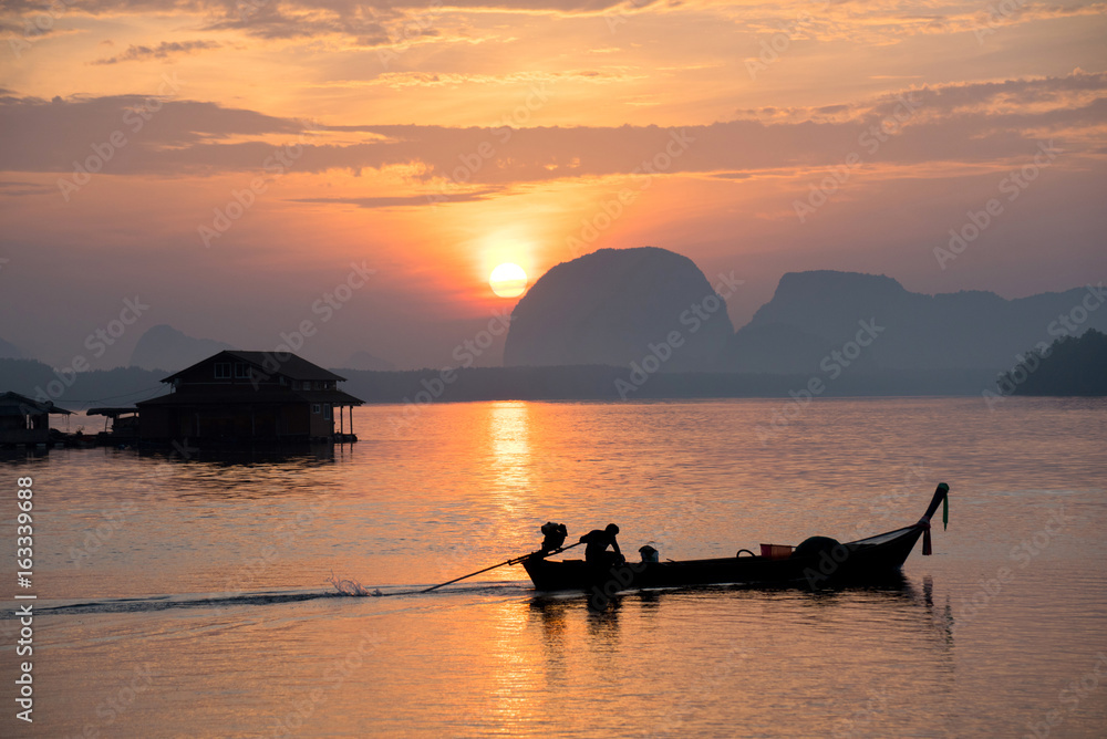 Calm sea and beautiful sunrise at BanSamChongTai, in Phang-nga province, Thailand.
