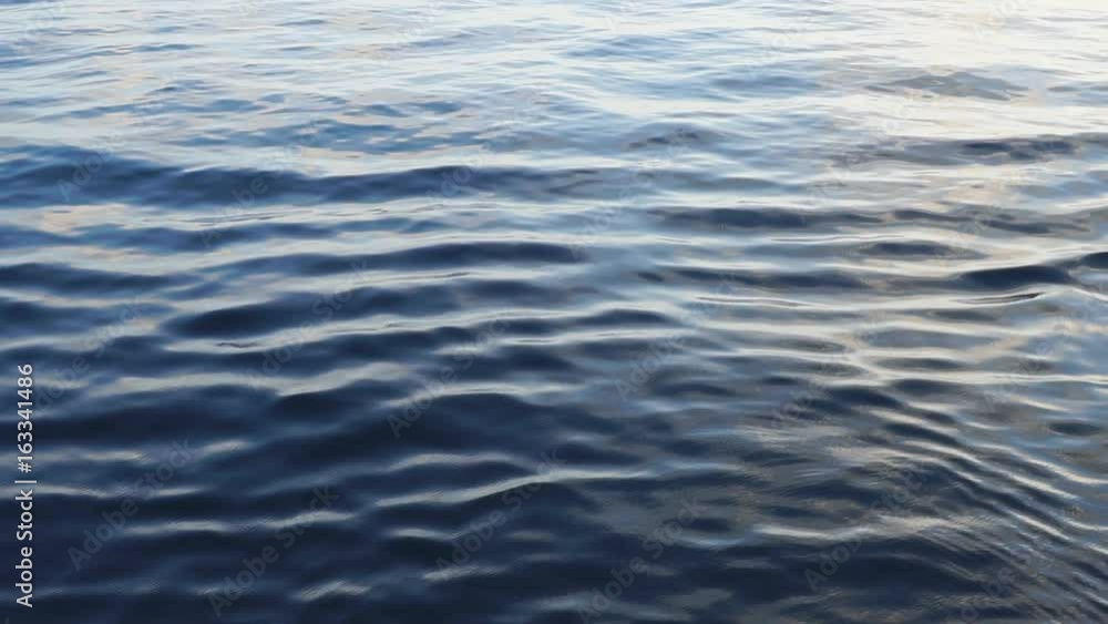 Calm surface of a blue sea - slow motion background. Calm surface of a blue sea - slow motion background.