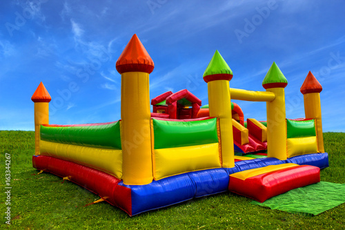Obraz na płótnie Inflatable colofrul castle for kids in playground w salonie