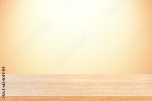 Wood table top on gradient beige background