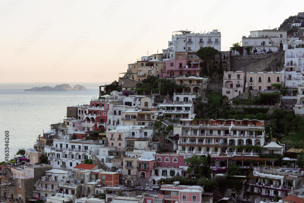 Positano coast - view from hillside with villas and boats on sea
