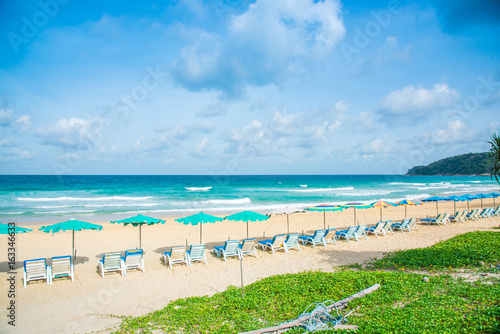 Fototapeta Naklejka Na Ścianę i Meble -  Row of beach chairs lined up on the beach in Phuket,Thailand.