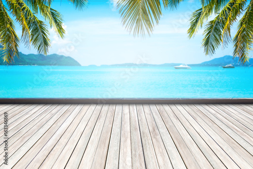 wooden floor and beautiful sea background in summer.