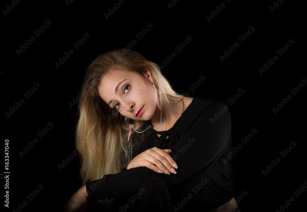 Portrait of a woman on black background. Portrait of a woman on black background.