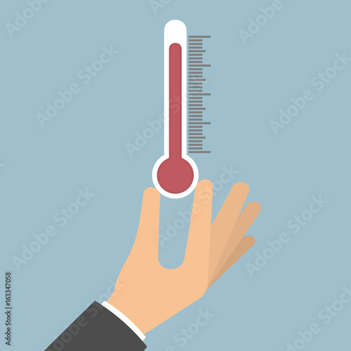Hand holding thermometer 