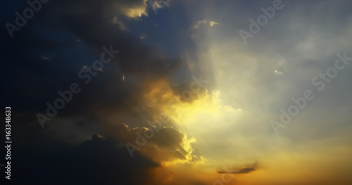 Dramatic atmosphere of beautiful summer sunset sky and clouds. © ekapolsira
