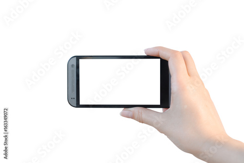Female hand holding a phone with blank screen isolated on white.