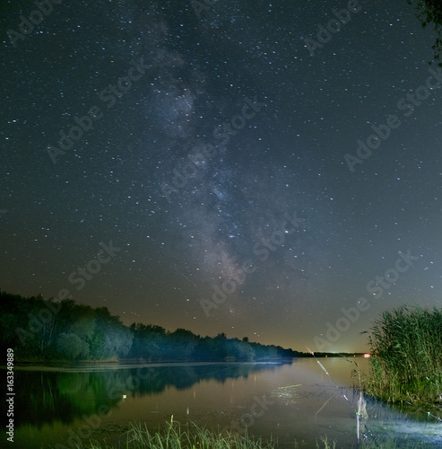 The milky way over the water of the river