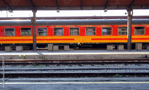 Colorful train wagon in station