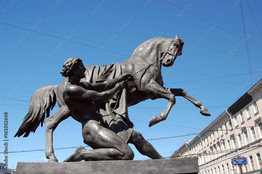 View of Horse tamers monument by Peter Klodt on Anichkov Bridge in Saint-Petersburg Russia

