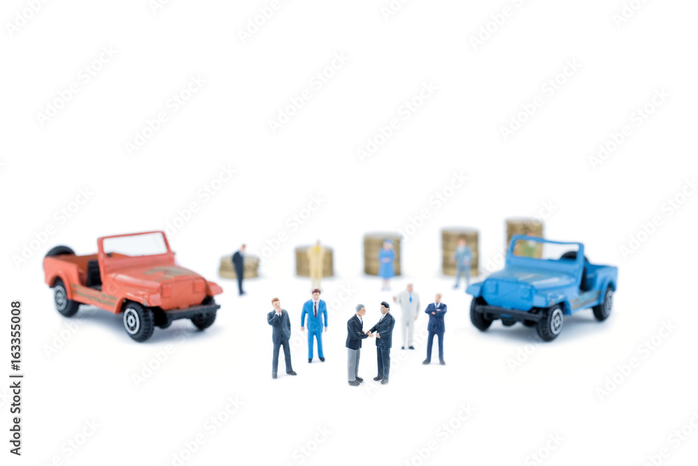 Fototapeta premium Miniature business people with car dealer in cars exhibition show