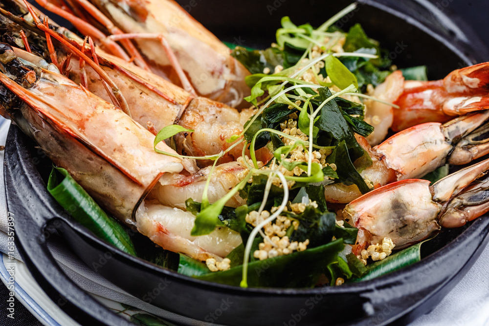 Royal prawns served with herbs and quinoa. Royal prawns served with herbs and quinoa.