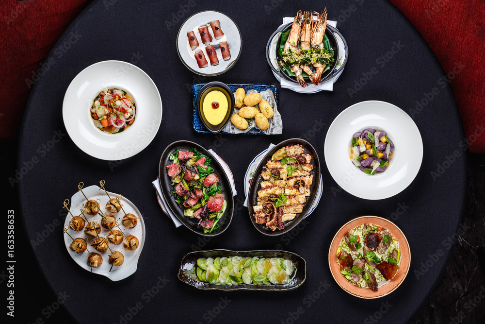 Selection of pan-Asian dishes on the table Selection of pan-Asian dishes on the table