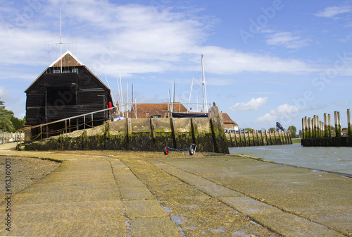 The long slipway and boathouse at the deep water channel in Bosham Harbor in West Sussex on the south coast of England