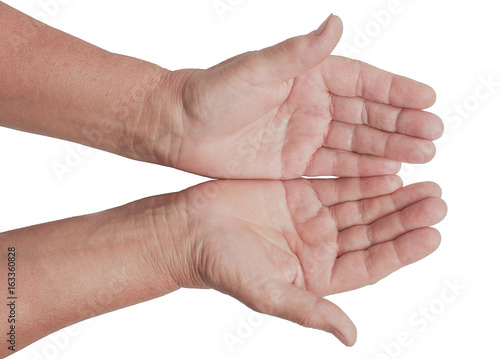 Two open empty hands of old woman with white background