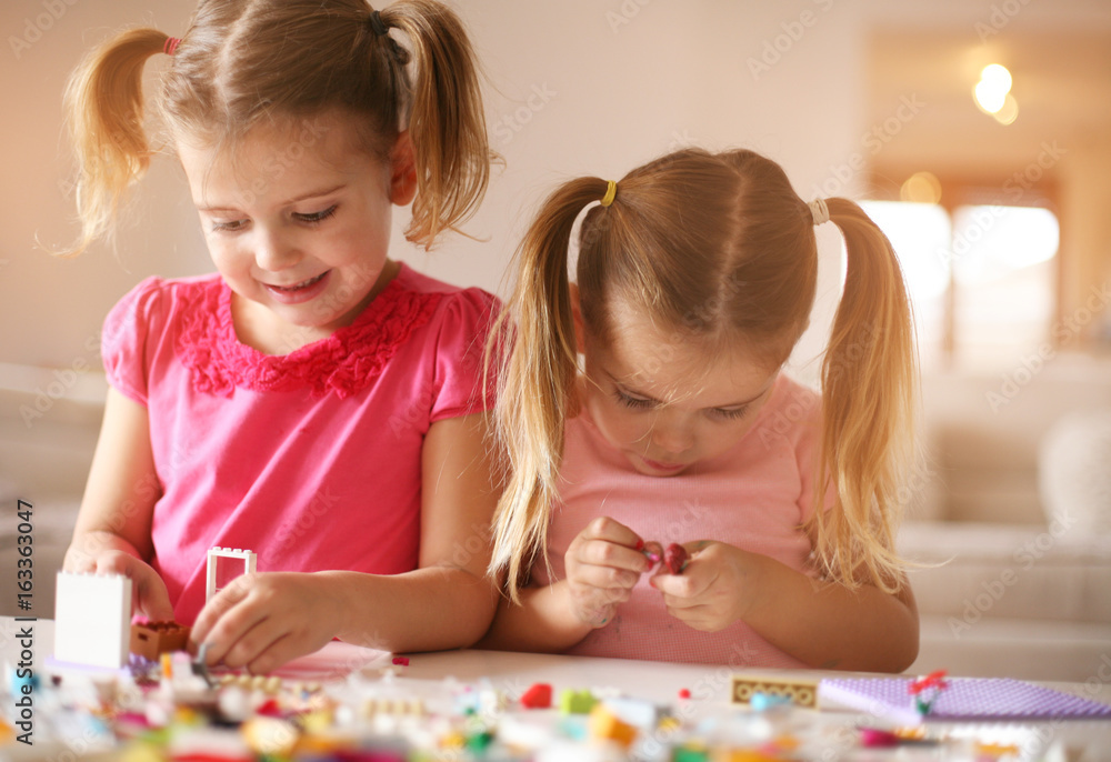 Fototapeta premium Girls playing at home.