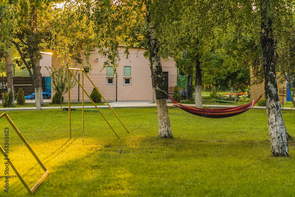 Hammock between two trees in a tourist resort
