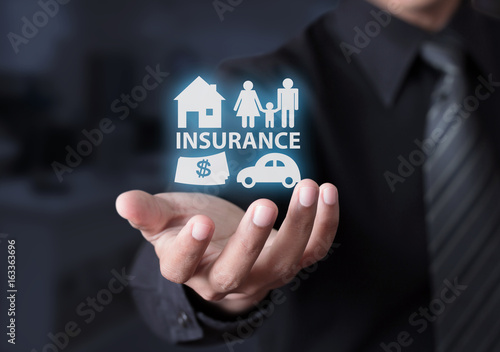 Concept of insurance with house, car, family and money