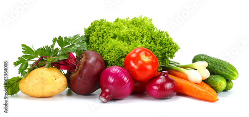 Assortment of fresh raw vegetables isolated on white background. Tomato, cucumber, onion, salad, carrot, beetroot, potato photo