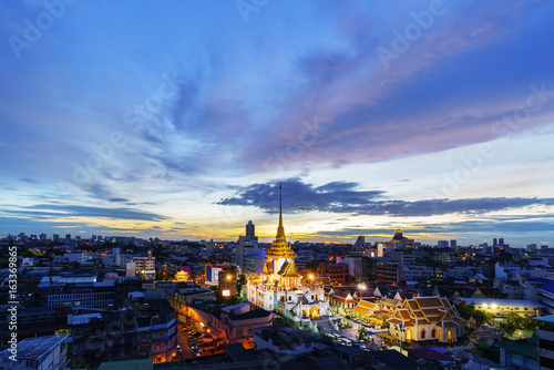 Cityscape of beautiful Wat Traimit or Temple of the Golden Buddha where the biggest solid golden Buddha statue is installed near the Chinatown , Bangkok , Thailand