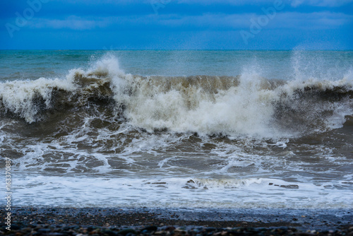 Fabulous stormy sea waves breaking near the coast
