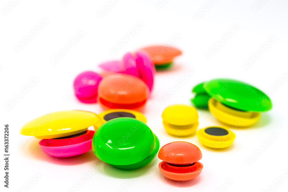 colored round magnets isolated on white background colored round magnets isolated on white background