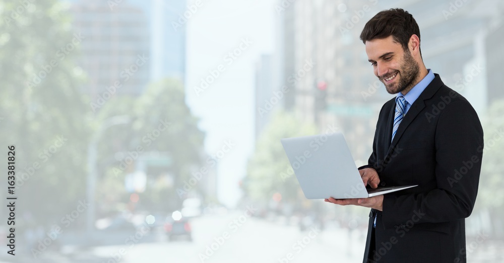 businessman on tablet in cityscape businessman on tablet in cityscape