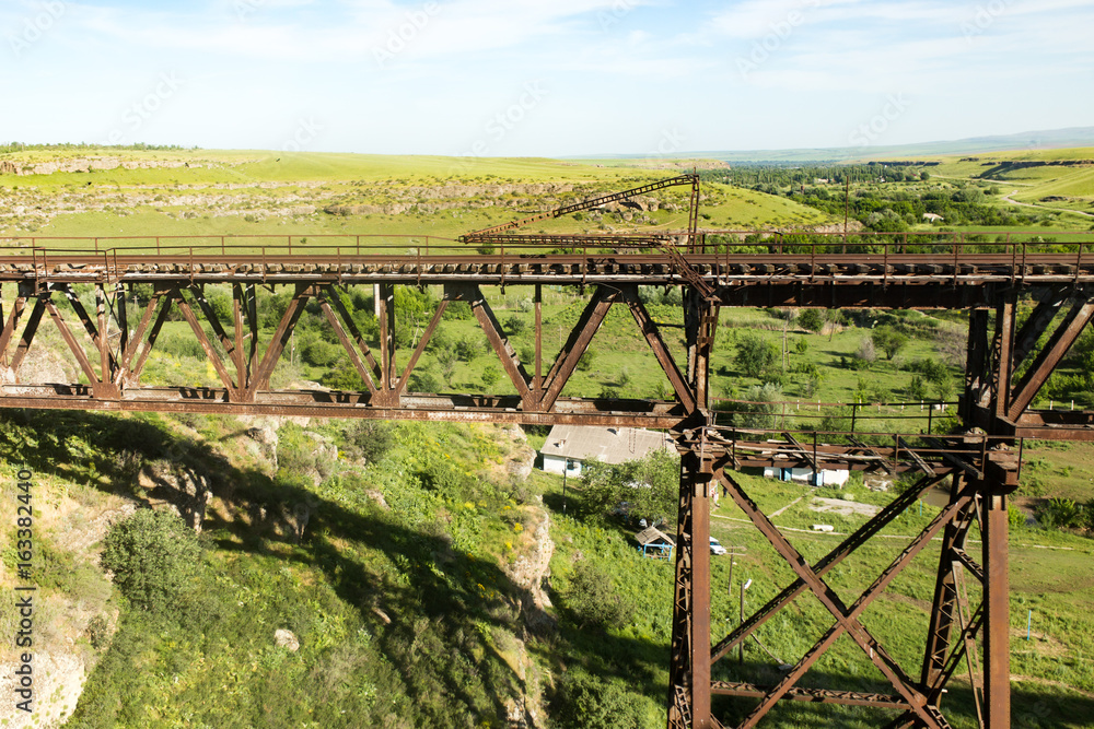 Old metal bridge with a railway