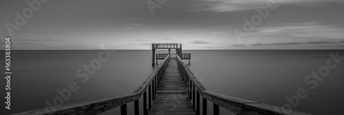 Black and white beach pier in Texas
