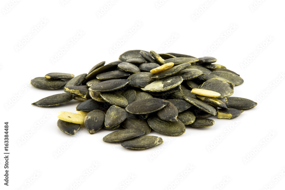 Pumpkin seeds peeled isolated on white background photo. Pumpkin seeds peeled isolated on white background photo.