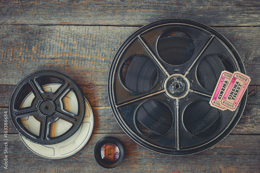 Fototapeta premium Reel with the film and movie tickets