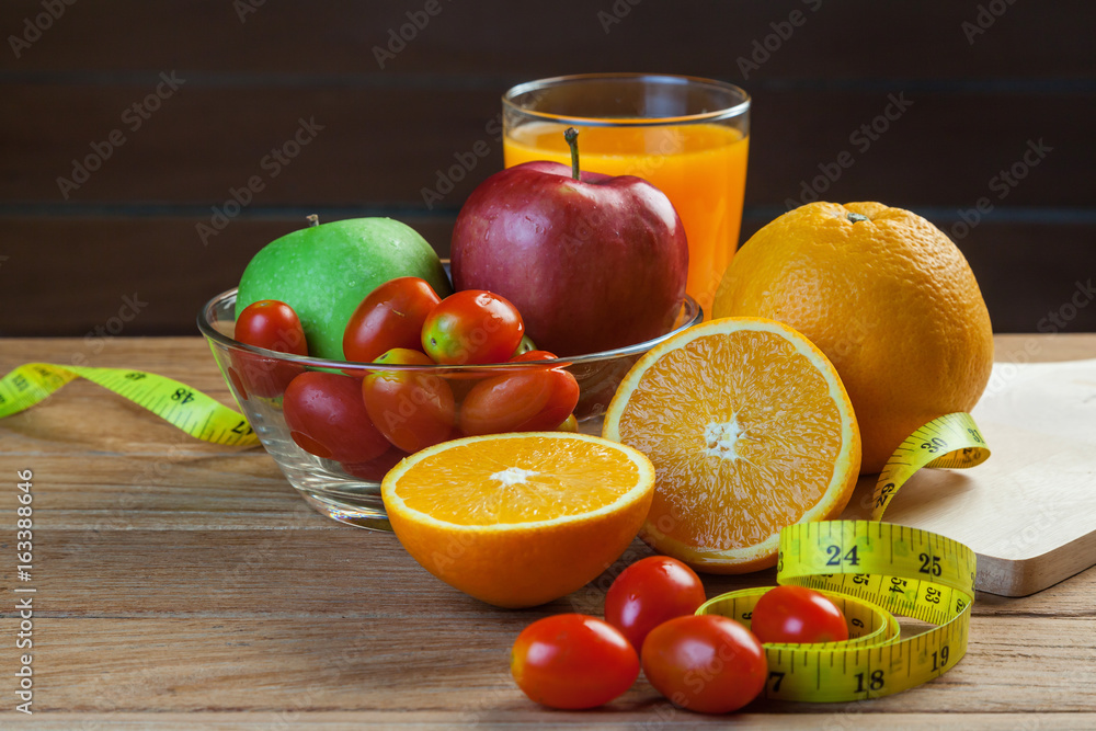 Healthy concept with mixed fruits and vegetables on wooden background Healthy concept with mixed fruits and vegetables on wooden background
