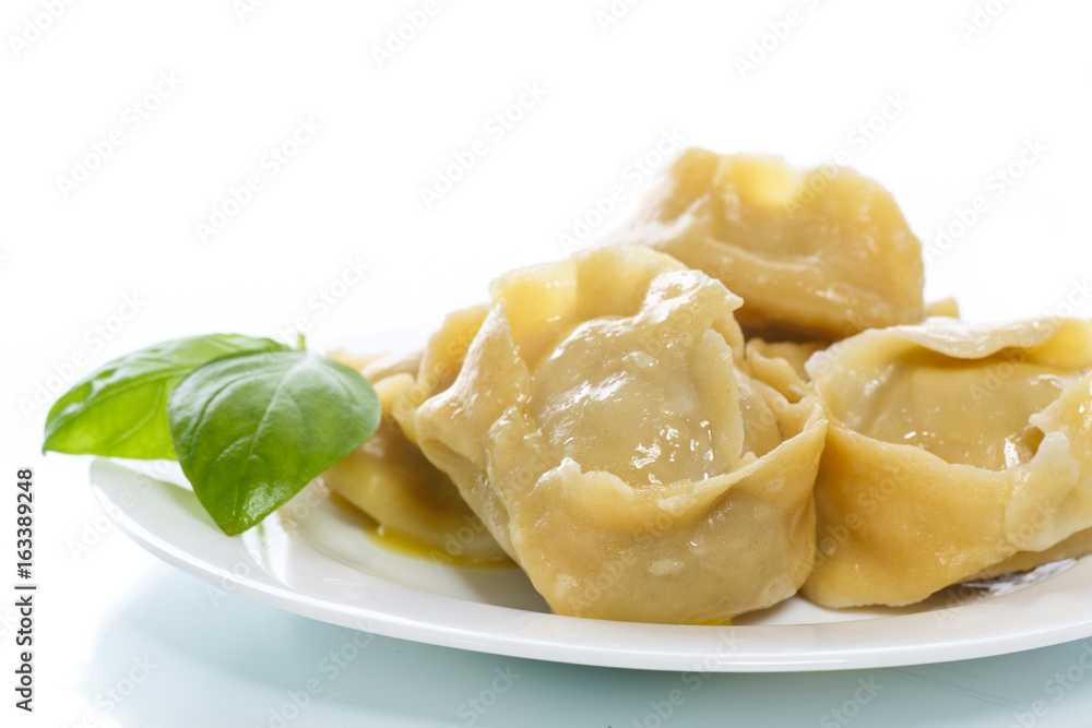 Boiled manti with meat on a plate