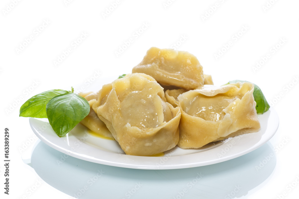 Boiled manti with meat on a plate