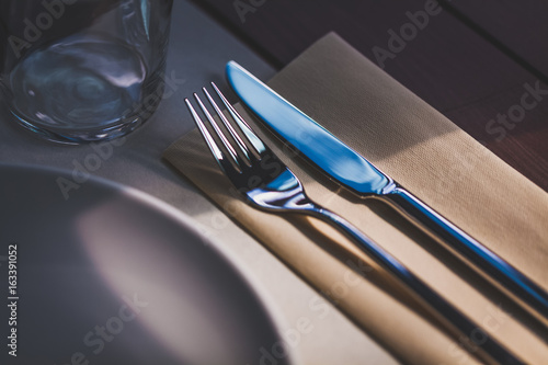 restaurant table setting on wooden table selected focus