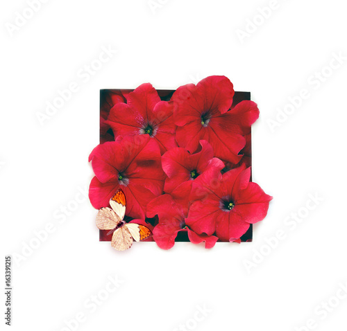 Creative layout made of flowers with paper card note. Flat lay. Nature concept