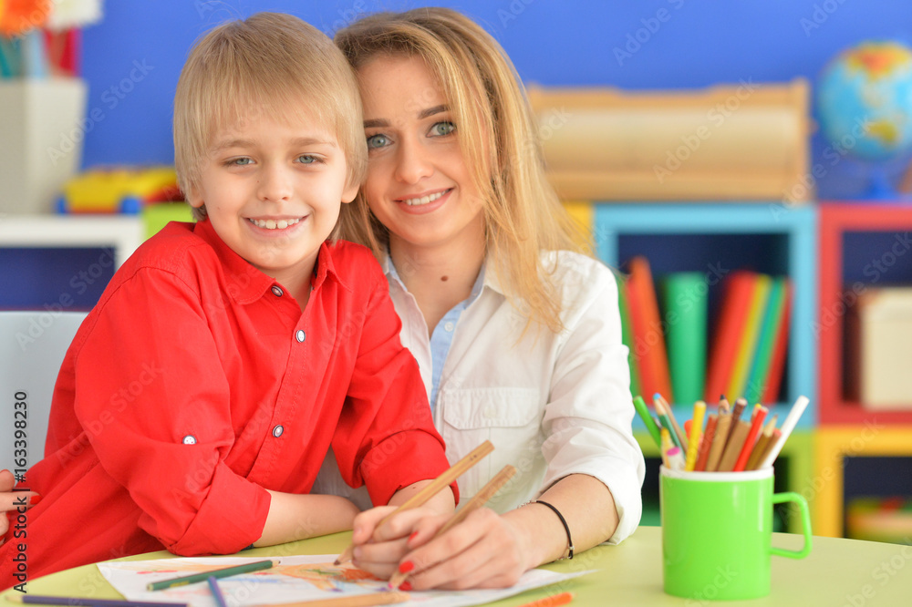 Mother with her son draw with pencils Mother with her son draw with pencils