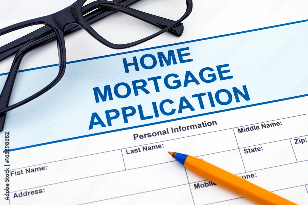 Home Mortgage Application with pen and glasses Home Mortgage Application with pen and glasses