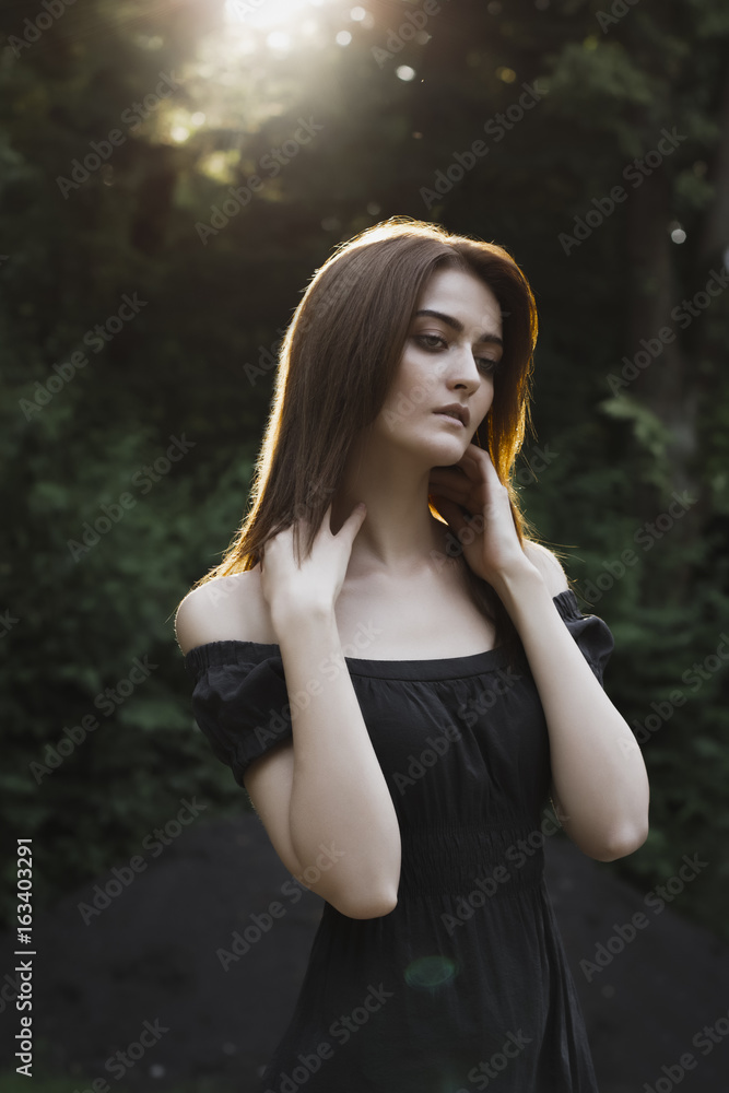 Attractive woman in a rays of sun Attractive woman in a rays of sun