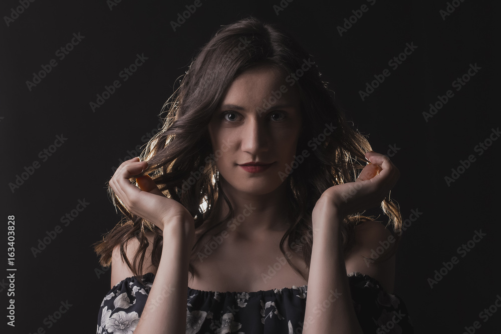 Confident brunette model in the shadows Confident brunette model in the shadows