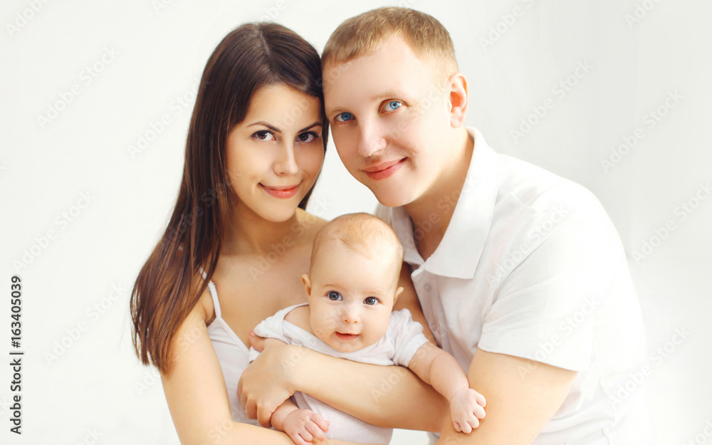Portrait happy family mother and father with baby at home Portrait happy family mother and father with baby at home