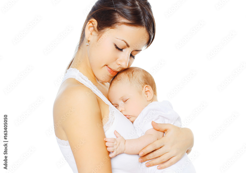 Portrait loving mother kissing her baby on a white background Portrait loving mother kissing her baby on a white background