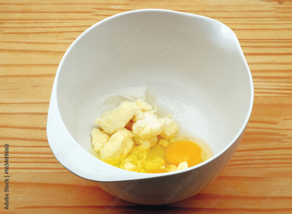 Bowl with margarine and eggs for the preparation of Plum Cake Bowl with margarine and eggs for the preparation of Plum Cake