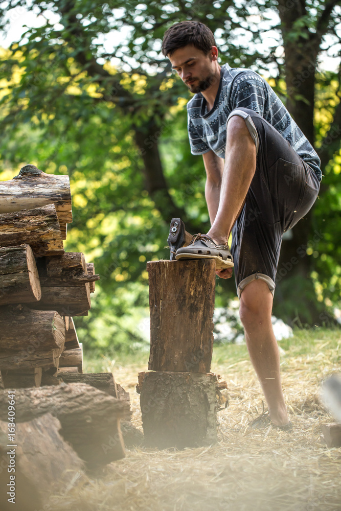Man chopping wood with an axe Man chopping wood with an axe