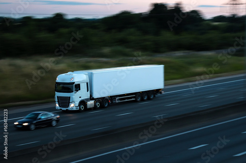 Road transport - white lorry at dusk