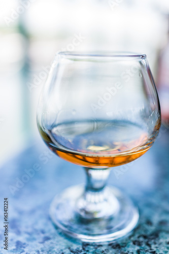 Macro closeup of amaretto, rum, or bourbon drink in glass