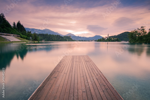 Fototapeta Naklejka Na Ścianę i Meble -  Wooden deck leading into Bled lake,Slovenia