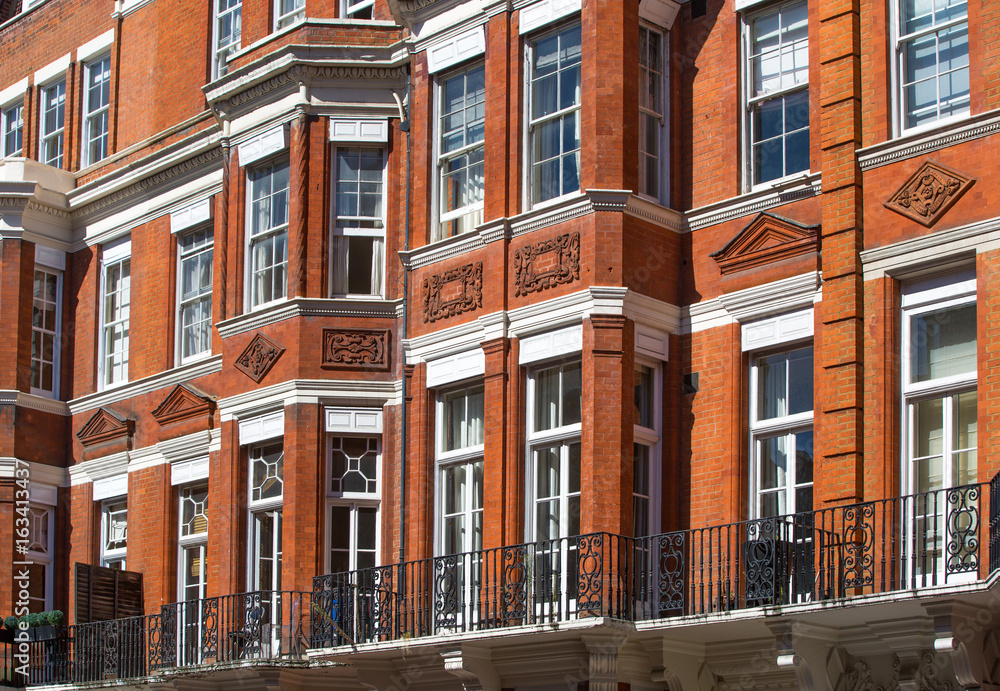 Windows of the luxury apartments in Mayfair. Centre London residential buildings.  