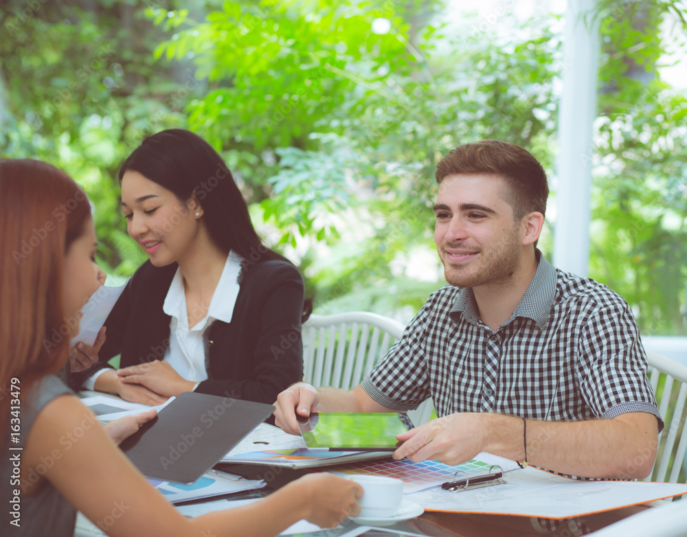 young business people making meeting and talking for analyzing marketing working at office on desk. young business people making meeting and talking for analyzing marketing working at office on desk.