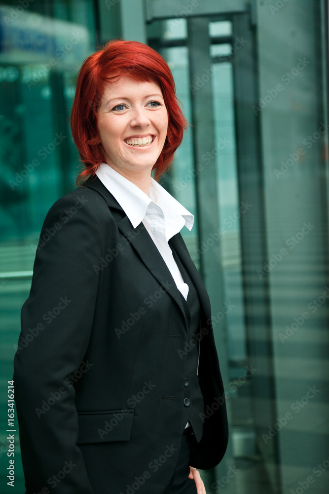 Businesswoman In Front Of An Office Building Businesswoman In Front Of An Office Building